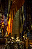 Luang Prabang, Laos - Wat Sene, a standing Buddha statue is housed inside an open pavilion. 